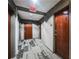 Building hallway with modern flooring and doors at 400 W Peachtree Nw St # 2810, Atlanta, GA 30308