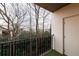 Private balcony with a black railing offering a wooded view at 970 Sidney Marcus Ne Blvd # 2113, Atlanta, GA 30324