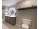 Modern bathroom with gray vanity and floating shelf at 970 Sidney Marcus Ne Blvd # 2113, Atlanta, GA 30324