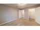 Well-lit bedroom with neutral walls, carpeting and closet at 970 Sidney Marcus Ne Blvd # 2113, Atlanta, GA 30324