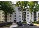 Apartment building exterior with trees and parking at 970 Sidney Marcus Ne Blvd # 2113, Atlanta, GA 30324
