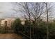Partial view of the apartment building exterior from behind a line of trees at 970 Sidney Marcus Ne Blvd # 2113, Atlanta, GA 30324