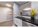 Modern kitchen with white cabinets, granite counters and stainless steel appliances at 970 Sidney Marcus Ne Blvd # 2113, Atlanta, GA 30324