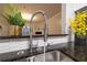 Modern kitchen sink with a pull-down faucet and granite countertop at 970 Sidney Marcus Ne Blvd # 2113, Atlanta, GA 30324