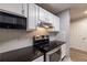 Kitchen with white cabinets, stainless steel appliances, and granite countertops at 970 Sidney Marcus Ne Blvd # 2113, Atlanta, GA 30324