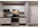 Updated kitchen with white cabinets and stainless steel appliances at 970 Sidney Marcus Ne Blvd # 2113, Atlanta, GA 30324