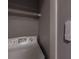 Small laundry closet with shelving and smart blind control at 970 Sidney Marcus Ne Blvd # 2113, Atlanta, GA 30324