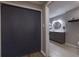 Convenient laundry room with washer, dryer, and shelving at 970 Sidney Marcus Ne Blvd # 2113, Atlanta, GA 30324