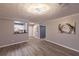 Spacious living room with hardwood floors and an open layout to the kitchen at 970 Sidney Marcus Ne Blvd # 2113, Atlanta, GA 30324