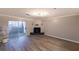 Living room with hardwood floors, fireplace and sliding glass door to balcony at 970 Sidney Marcus Ne Blvd # 2113, Atlanta, GA 30324