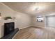 Living room with hardwood floors, fireplace, and kitchen pass-through at 970 Sidney Marcus Ne Blvd # 2113, Atlanta, GA 30324