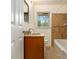 Updated bathroom with granite vanity and tile flooring at 2070 Brannen Se Rd, Atlanta, GA 30316