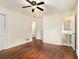 Main bedroom with hardwood floors, ceiling fan and en-suite bathroom at 2070 Brannen Se Rd, Atlanta, GA 30316