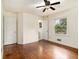 Bright bedroom with hardwood floors, ceiling fan, and ample closet space at 2070 Brannen Se Rd, Atlanta, GA 30316