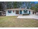 Newly painted white brick ranch home with teal shutters and a spacious driveway at 2070 Brannen Se Rd, Atlanta, GA 30316
