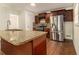 Modern kitchen with granite island and stainless steel refrigerator at 2070 Brannen Se Rd, Atlanta, GA 30316