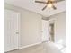 Simple bedroom with neutral walls and ceiling fan at 396 Southern Trace Dr, Rockmart, GA 30153