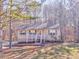 Beige house exterior with a porch and large windows at 396 Southern Trace Dr, Rockmart, GA 30153