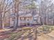 House exterior showcasing a light beige color and a covered porch at 396 Southern Trace Dr, Rockmart, GA 30153