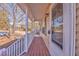 Covered front porch with wooden deck and white railings at 396 Southern Trace Dr, Rockmart, GA 30153