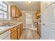Galley kitchen with wood cabinets and updated flooring at 396 Southern Trace Dr, Rockmart, GA 30153