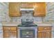 Kitchen boasts stainless steel appliances and wood cabinets at 396 Southern Trace Dr, Rockmart, GA 30153