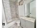 Clean bathroom with gray vanity and marble tile at 545 Angier Ne Ave, Atlanta, GA 30308