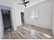 Light-filled bedroom with hardwood floors and access to stairs at 545 Angier Ne Ave, Atlanta, GA 30308