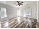 Bright bedroom featuring hardwood floors and a ceiling fan at 545 Angier Ne Ave, Atlanta, GA 30308
