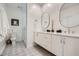 Modern bathroom featuring dual sinks, ample counter space, a large mirror, and a glass shower at 400 Pratt Se Dr # 1403, Atlanta, GA 30315