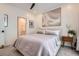 Comfortable bedroom with a plush bed, a stylish light fixture, and access to the bathroom at 400 Pratt Se Dr # 1403, Atlanta, GA 30315