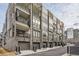 Brick townhome exterior featuring balconies, garages, and modern design elements at 400 Pratt Se Dr # 1403, Atlanta, GA 30315