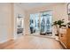 Bright living room with hardwood floors, a sliding glass door to the balcony, and modern decor at 400 Pratt Se Dr # 1403, Atlanta, GA 30315