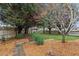 Landscaped backyard with a pergola and stone pathway at 595 Ellesmere Way, Buford, GA 30518