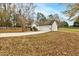 View of the home's side showcasing the garage and driveway at 504 Leguin Mill Rd, Locust Grove, GA 30248