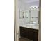 Bathroom features white walls, dark wood cabinets and an above-counter sink and faucet at 507 Augusta Se Dr, Marietta, GA 30067