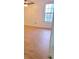 Bright bedroom with wood-look flooring, ceiling fan, and natural light from a window at 507 Augusta Se Dr, Marietta, GA 30067