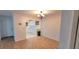 Dining room with wood floors and a chandelier leading to an updated kitchen at 507 Augusta Se Dr, Marietta, GA 30067