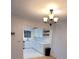Dining room with view of updated kitchen featuring stainless steel appliances and white cabinets at 507 Augusta Se Dr, Marietta, GA 30067