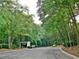 Community entrance surrounded by lush greenery and trees creating a peaceful and welcoming entry at 507 Augusta Se Dr, Marietta, GA 30067