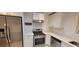 Updated kitchen featuring stainless steel appliances, white cabinets, and patterned floor at 507 Augusta Se Dr, Marietta, GA 30067