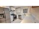 Updated kitchen featuring stainless steel appliances, white cabinets, and patterned floor at 507 Augusta Se Dr, Marietta, GA 30067
