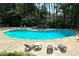 Inviting community pool with lounge chairs and table perfect for relaxing poolside at 507 Augusta Se Dr, Marietta, GA 30067