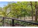 Scenic balcony view featuring lush greenery and a decorative iron railing, creating a serene outdoor escape at 273 12Th Ne St # 210, Atlanta, GA 30309