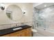 Bathroom features stone countertops, marble tile, and shower/tub combination at 273 12Th Ne St # 210, Atlanta, GA 30309