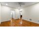 Inviting bedroom features gleaming hardwood floors, white trim, and multiple doorways for easy access throughout the home at 273 12Th Ne St # 210, Atlanta, GA 30309