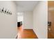 Hallway leads to a kitchen with hardwood floors and coat hooks to the left at 273 12Th Ne St # 210, Atlanta, GA 30309