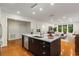 Contemporary kitchen island with stainless steel appliances, hardwood floors, and bright living space at 273 12Th Ne St # 210, Atlanta, GA 30309