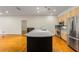 Modern kitchen island with stainless steel appliances and light wood cabinetry, perfect for entertaining at 273 12Th Ne St # 210, Atlanta, GA 30309