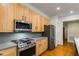 A well-lit kitchen showcases stainless steel appliances and light wood cabinetry at 273 12Th Ne St # 210, Atlanta, GA 30309